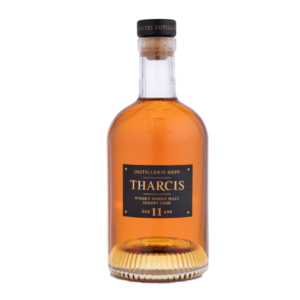 Bouteille de whisky alsacien HEPP Tharcis Sherry Cask 11 ans, single malt couleur acajou, étiquette noire et or, bouchon en liège